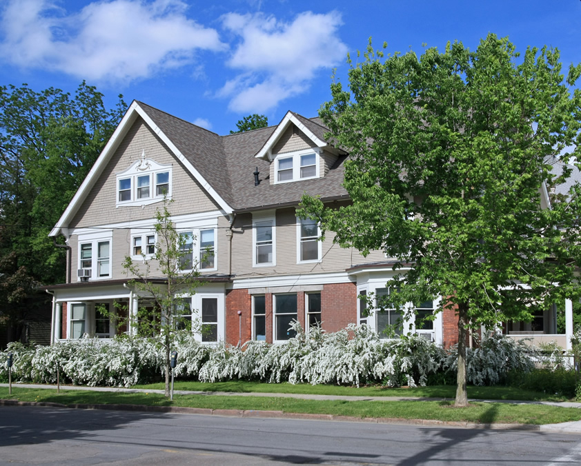 Sorority House with White Flowering bushes