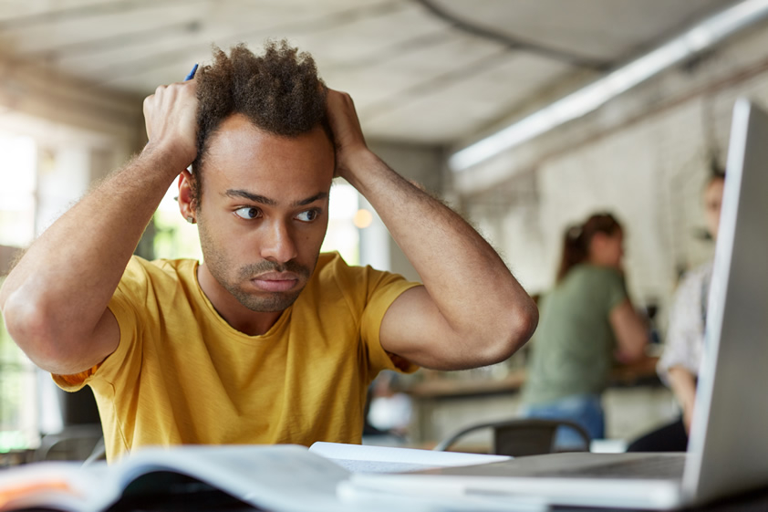 Stressed Out College Student with yellow shirt