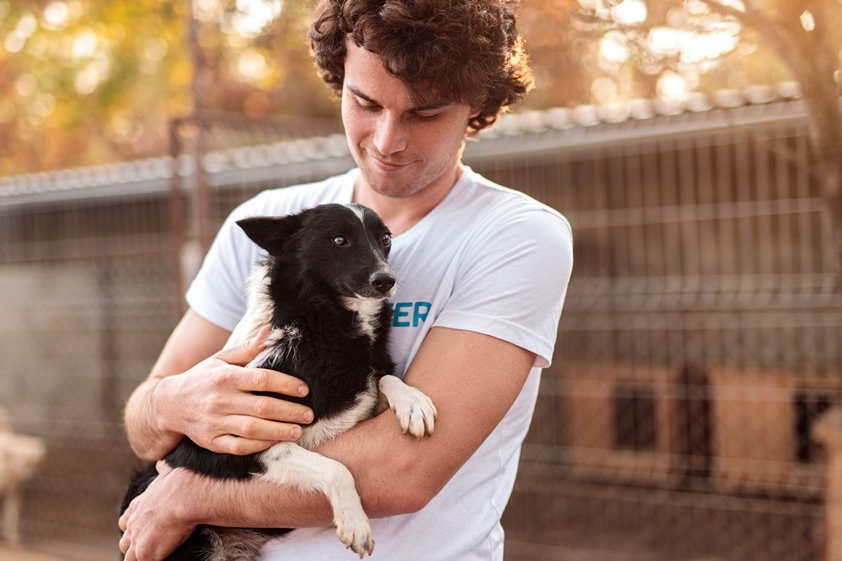 Young man with small dog